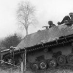 Subject: German soldiers riding in tank during the "Battle of the Bulge" Belgium 1944.
Photographer- U.S. Army
Public Domain
Merlin-1141002